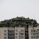 Illustration for article titled Chinese doctor builds illegal rock villa atop Beijing apartment tower